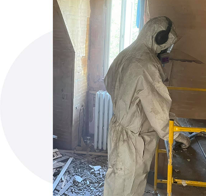worker-removing-asbestos-mold-from-attic